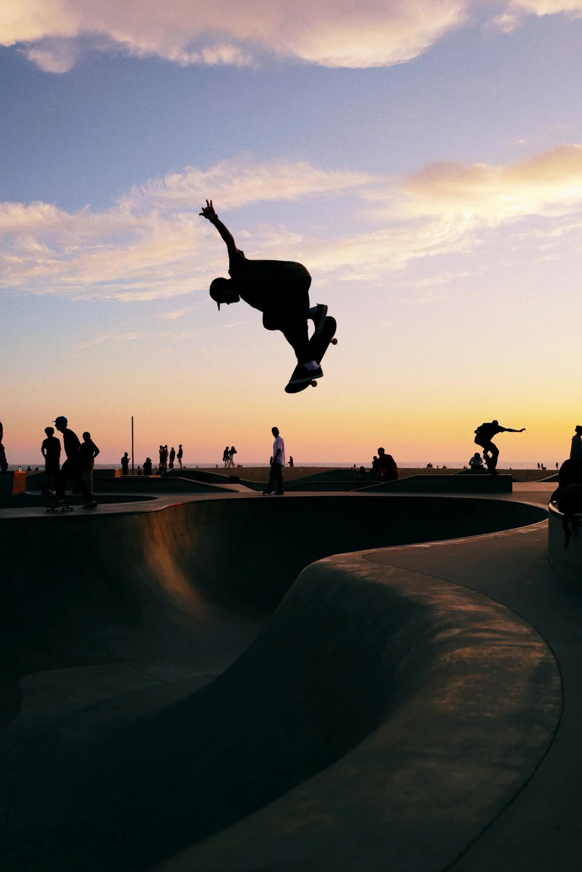 A skateboarder doing a high drop